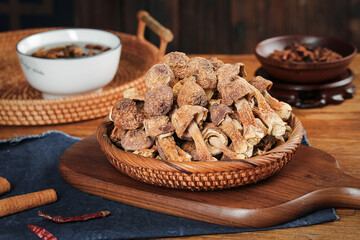 Fototapeta premium Dried Matsutake Mushrooms Raw Ingredients in Wicker Basket Asian Cooking Setup