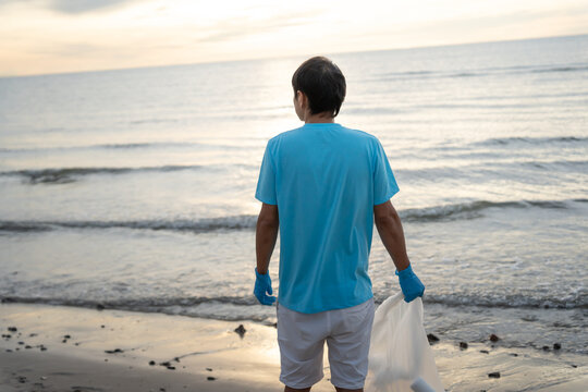 Save water. Volunteer pick up trash garbage at the beach and plastic bottles are difficult decompose prevent harm aquatic life. Earth, Environment, Greening planet, reduce global warming, Save world