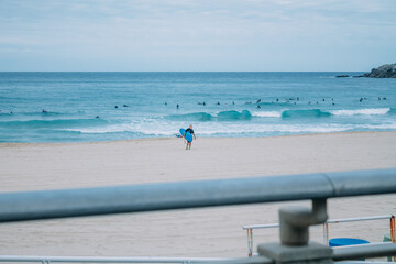 Fototapeta premium Zurriola beach in Donosti or San Sebastian with surfers in the background