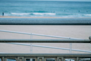 Fototapeta premium Zurriola beach in Donosti or San Sebastian with surfers in the background