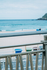 Fototapeta premium Zurriola beach in Donosti or San Sebastian with surfers in the background