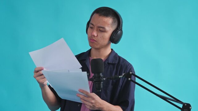 Expressive presenter looking astonished while reviewing script pages on blue background