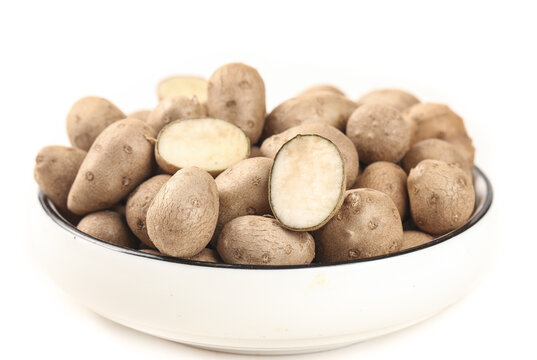 Hebei Iron Stick Yam Tubers in White Bowl - Fresh Chinese Mountain Yam Roots on White Background