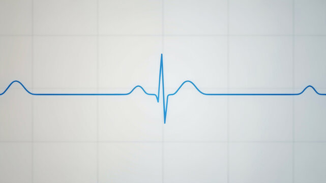 Heartbeat Line on a Grid: A clear blue line representing a human heartbeat is displayed on a white grid, symbolizing vital signs and medical data.
