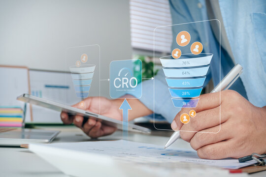 Handwriting on paperwork with digital CRO conversion rate optimization and marketing sales funnel hologram screens, concept of business growth, data analytics, and digital marketing strategy, CRO.