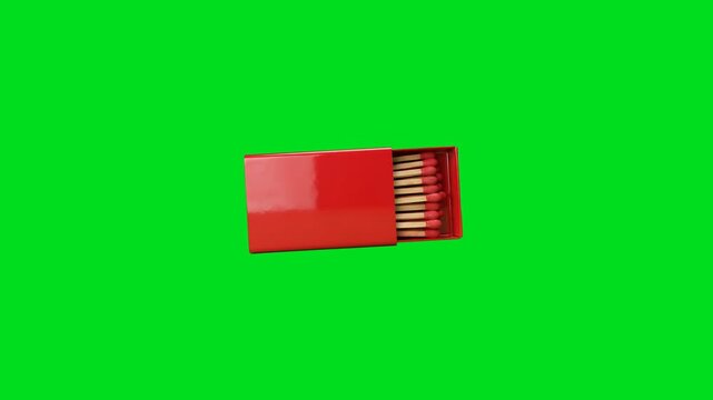 A red matchbox with wooden matches isolated against a vibrant green screen