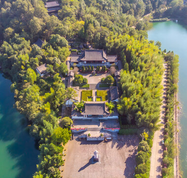 Asian Temple Complex Aerial View with Turquoise Lake and Pine Forest