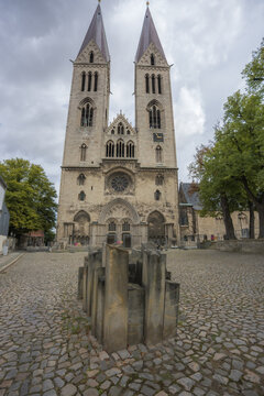 Symmetrical facade of historic Halberstadt Cathedral and square in Germany