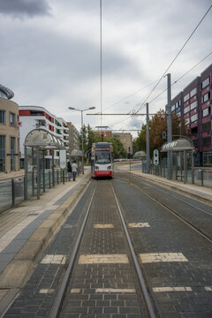 Modern electric tram arriving at a city station in Halberstadt Germany