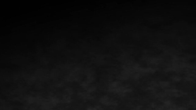 white smoke effect. smooth swirling smoke black background. realistic white smoke flowing through the air with soft mist, 4k loop.