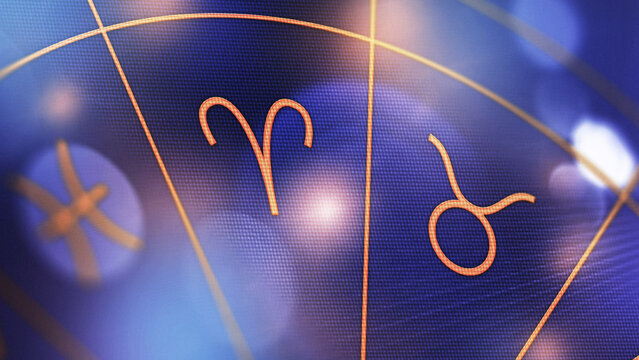 Astrology zodiac signs display with symbols for Aries and Taurus on a blue background