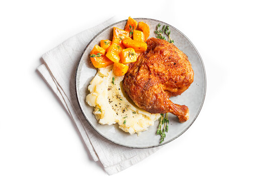 Autumn meal: chicken quarter with glazed pumpkin and mashed potato