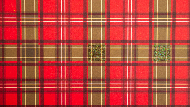 Red plaid tartan pattern with detailed geometric lines and green accents