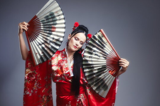 Elegant Mature Woman 40s as Japanese Kitsune in Red Kimono with Fans