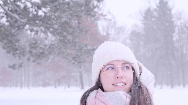 Woman cold season. Female walking outdoors in winter landscape. Slow living concept.