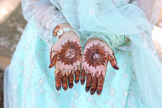 Bridal mehndi- henna tattoo on women hands. mehndi is a traditional indian decorative art. ( mehndi hands), Indian and pakistani wedding tradition.