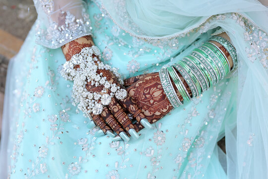 Bridal mehndi- henna tattoo on women hands. mehndi is a traditional indian decorative art. ( mehndi hands), Indian and pakistani wedding tradition. 