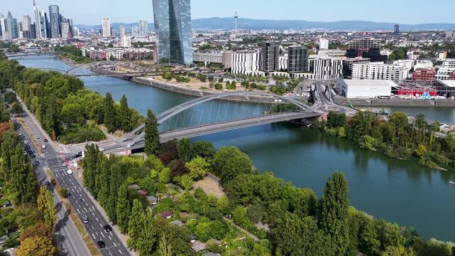 Osthafenbrucke Bridge In Hesse Germany. Modern Bowstring Arch. Downtown City. Cable Stayed Bridge. Osthafenbrucke Bridge In Frankfurt In Hesse Germany. Freeway Road. Europe Skyline.
