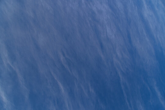 Wispy Cirrus Clouds Against a Deep Blue Sky