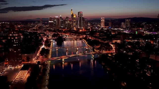 Night over Frankfurt Skyline In Hesse Germany. Illuminated City. Downtown District. Highrise Buildings. Frankfurt Skyline In Frankfurt In Hesse Germany. Beautiful Cityscape. European Skyline.