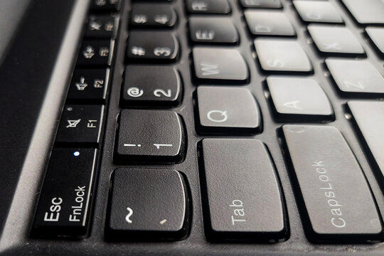 The Esc and FnLock keys are located at the bottom-left corner of the Lenovo ThinkPad laptop keyboard.