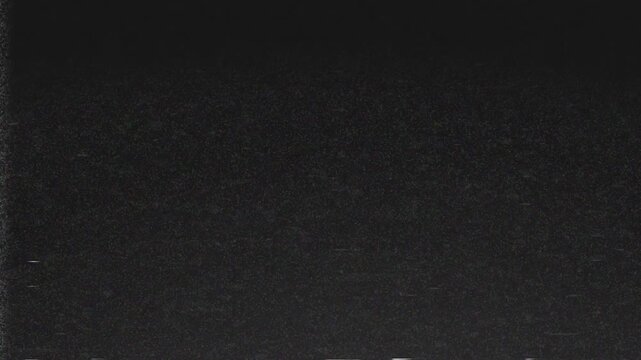 An old film VHS tv overlay effect showcasing retro noise tv grain texture footage. 4k retro vintage video.
