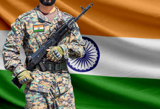 India flag with soldier holding assault rifle