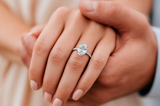 Romantic Engagement Ring and Couple Holding Hands