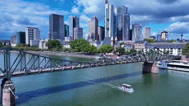 Iron Bridge In Frankfurt Am Main In Hesse Germany. Historical Bridge. Corporate Buildings. European Destination. Iron Bridge In Frankfurt Am Main In Hesse Germany. Tourism Landmark.