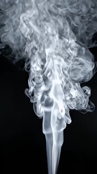 White Smoke Swirls Rising Against Dark Background - Ethereal white smoke swirls gracefully upward against a deep black background.