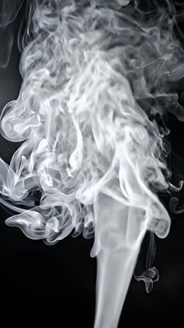 Abstract White Smoke Swirls Rising Against Dark Background - Ethereal white smoke gracefully swirls and rises upwards against a stark, dark background.