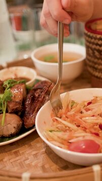 Traditional Thai Meal with Som Tum Papaya Salad and Grilled Chicken