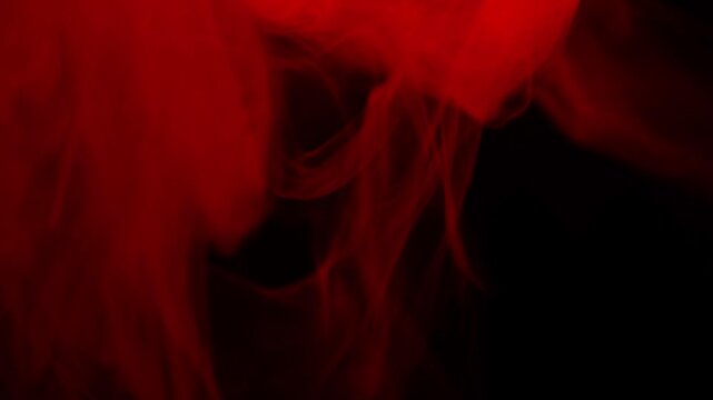 Real Red Smoke on Black Background