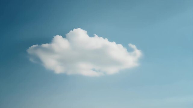 A single, fluffy white cloud drifts in a clear blue sky.