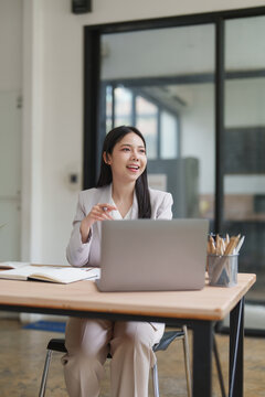 Young businesswoman smiling and discussing during office meeting