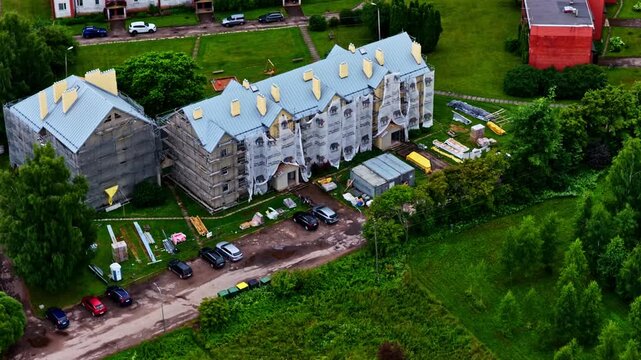 High angle view of a residential building during facade restoration and modernization