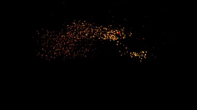 Halloween text disintegrates into golden particles against a black background disintegrate decay
