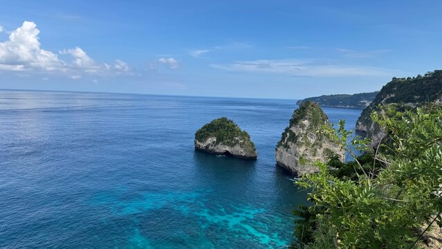 Tropical limestone cliffs and rock formations in turquoise ocean