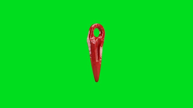 A shiny red metal climbing piton isolated on a vibrant green screen background