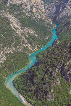 Little canoes navigating on de Verdon river in the canyon, seen from the viewpoint of the cirque de Vaumale