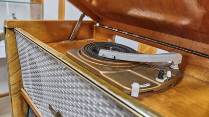 Vintage turntable and radiogram in open wooden case © IrinaK