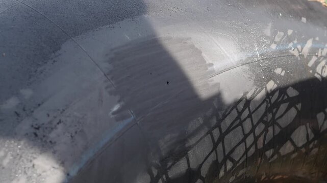 Cold patch tire repair involves applying a textured circular patch over the puncture site using adhesive and a plastic backing to repair a punctured tubeless tire.
