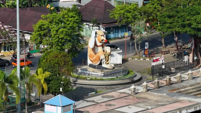 Large monkey statue in a public park in Banjarmasin South Kalimantan Indonesia on a sunny day