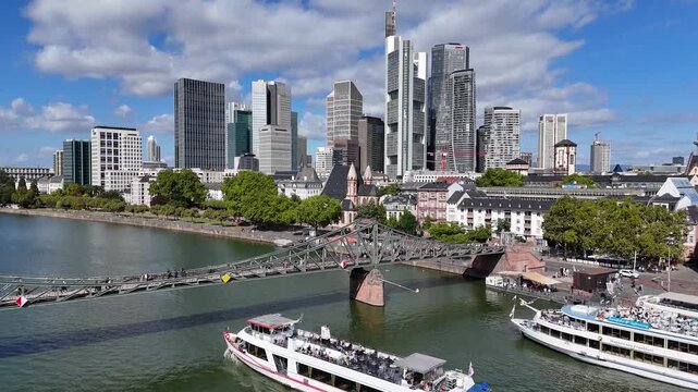 Iron Bridge In Frankfurt Am Main In Hessen Germany. Historical Bridge. Corporate Buildings. European Destination. Iron Bridge In Frankfurt Am Main In Hessen Germany. Tourism Landmark.