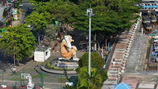 Aerial view of the iconic Bekantan monkey statue located at the riverfront park in Banjarmasin