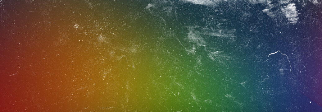 Abstract rainbow gradient background featuring scratched texture overlay perfect for digital art and creative design works.