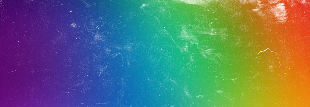 Vibrant spectrum gradient background with distressed film texture ideal for colorful advertising and creative media art.