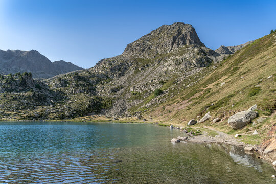 Estany de les Abelletes Lake Shore with Pyrenees Mountain Peaks, Andorra