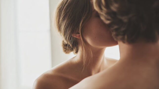 Young couple sharing an intimate and tender moment in soft natural light