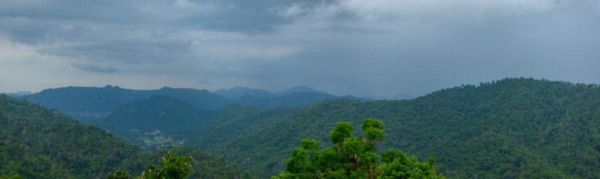 Scenic View of Lush Mountains in Yai with Overcast Sky